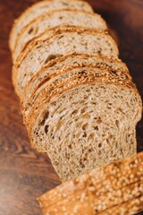 Close-up shot of a freshly sliced loaf of bread on a cutting board