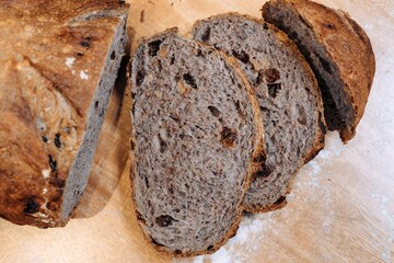 Close-up shot of a freshly sliced loaf of bread on a cutting board