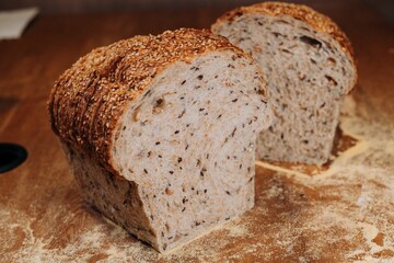 Close-up shot of a freshly sliced loaf of bread on a cutting board