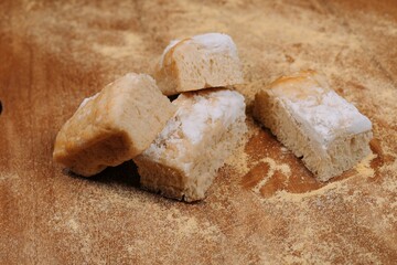 Delicious, freshly-baked cake sits atop a wooden table