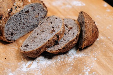 Close-up shot of a freshly sliced loaf of bread on a cutting board