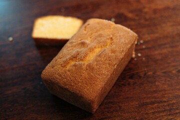 Delicious, freshly-baked cake sits atop a wooden table