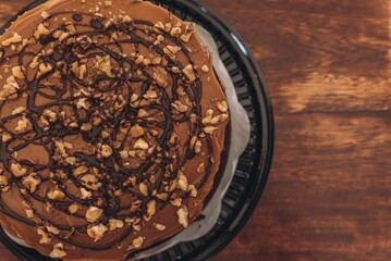 Delicious, freshly-baked cake sits atop a wooden table