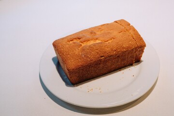 Delicious, freshly-baked cake sits atop a wooden table