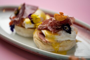 Closeup of eggs Benedict served on a plate