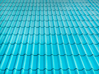 Bright blue roof tiles reflect sunlight and look beautiful, Texture of fiber cement roof sheet for pattern and background.
