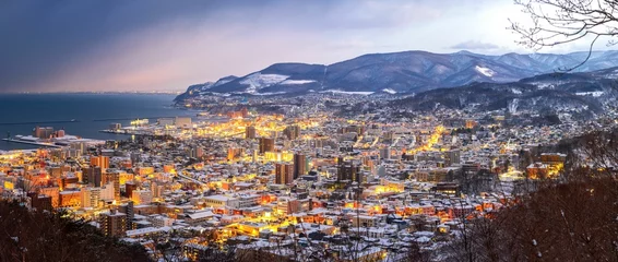 Fotobehang Chocoladebruin Panoramic view of Otaru with evening illumination. Hokkaido, Japan.  © Wirestock