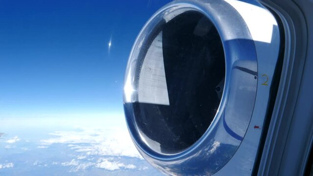 Rear Mounted Turbofan Jet engine View from Airplane Passenger Window