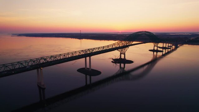 Drone footage of the Laviolette arch Bridge over the St. Lawrence River at sunset, Canada