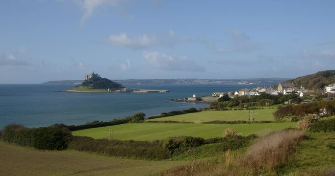extra wide shot of St Michael's mount with the village of Marazion right of frame