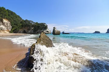 Fotobehang Cathedral Cove, a popular tourist destination located in the Coromandel Peninsula of New Zealand © Wirestock