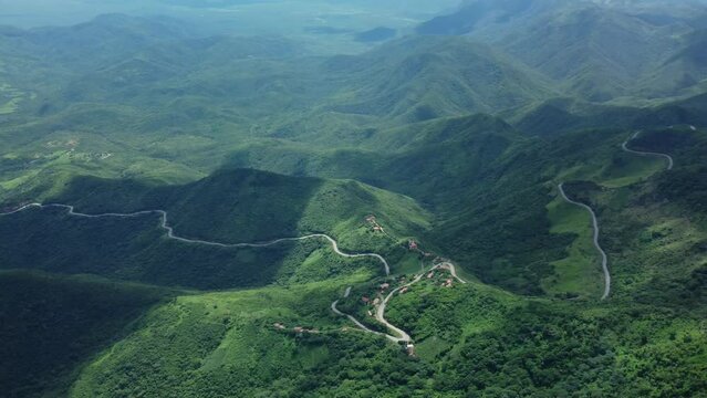 High drone footage of the trails and roads on Pico Alto mountain range in Guaramiranga, Brazil