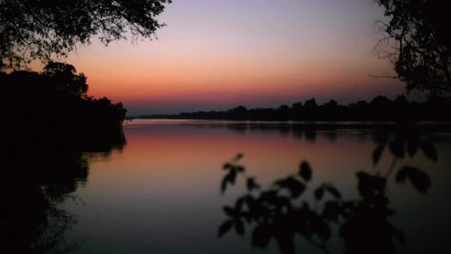 Zambia's Kafue River painted in evening purples and pinks