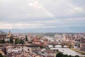 Fototapeta na wymiar Cityscape of Florence under a cloudy sky in Italy