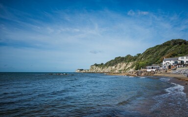 Naklejka premium Picturesque view of Steephill Cove on the Isle of Wight, featuring the beach and its rocky shore