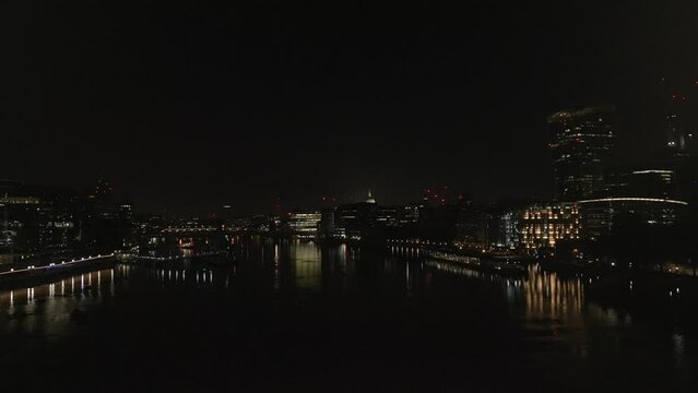 Drone footage of the city of London and the Tower Bridge at night, United Kingdom