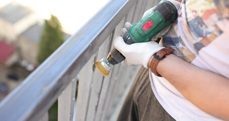 Removing rust and old paint from metal using angle grinder