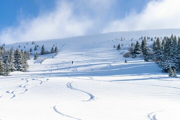 Man skiing down a mountain slope in Austria