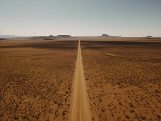 Fototapeta na wymiar AI generated illustration of a road in a desert under the sunlight