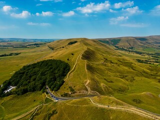 Aerial view of the Hills of Mam Tor in the Peak District winding road snaking through a valley