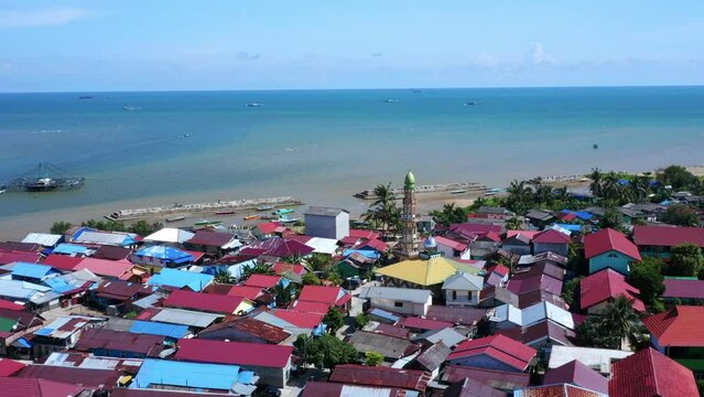 Mosque Minaret And Colorful Roofs Of Settlements In Manggar, Balikpapan Port City In East Kalimantan, Indonesia. Aerial Shot