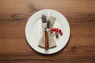 Stylish autumn table setting on wooden background, flat lay
