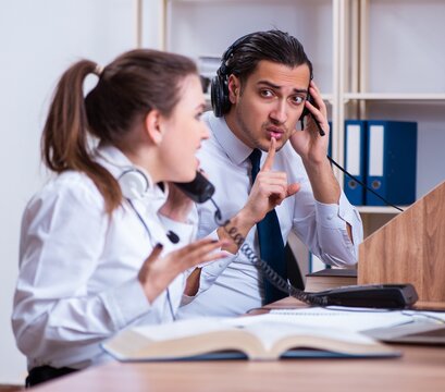 Call center operators working in the office