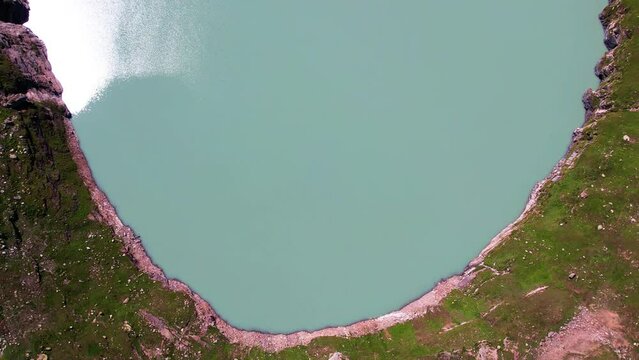 Revealing aerial of Chitta Katha Lake, often referred to as the "Gem of Neelum Valley," an stunning high-altitude lake located in the Neelum Valley of Azad Kashmir, Pakistan. Untouched nature concept.