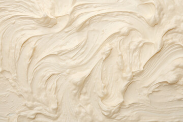 Close up detail of milk vanilla white creamy ice cream surface and texture is swirled and mixed,...
