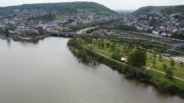 Aerial cityscape of Bingen am Rhein with train on Nahe railway Bridge, Germany