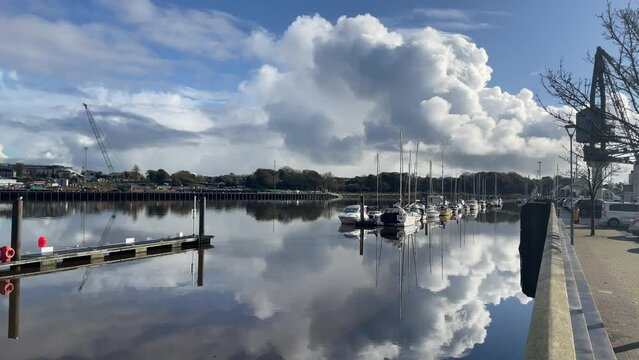 River reflections and Leasure boats still water in Waterford Ireland