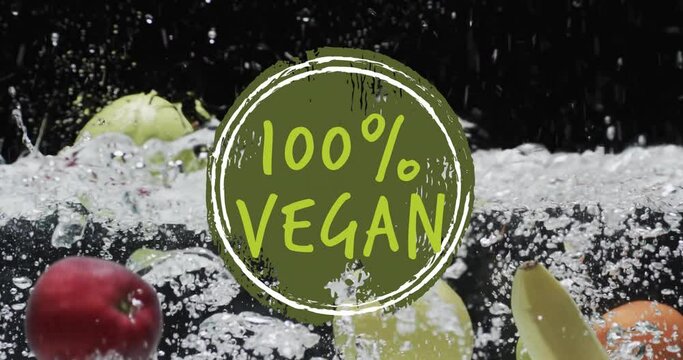Animation of 100 percent vegan text over fruit falling in water background