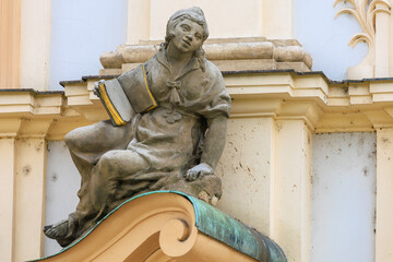 Ancient sculptures in the architecture of the city. Historical and cultural heritage. Background.