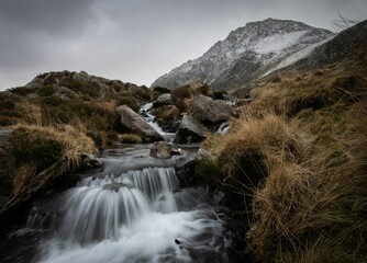 Naklejka na ściany i meble Small waterfall with long exposure in Tryfan, Snowdonia, Wales