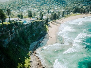 Scenic view of a beach surrounded by a mountain range, in Newport, Sydney, NSW, Australia