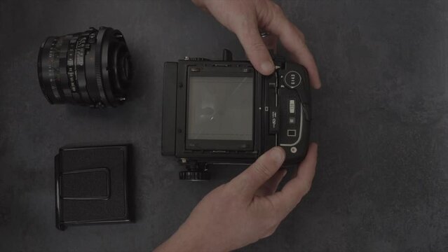 operating a vintage analogue 120 medium format film camera