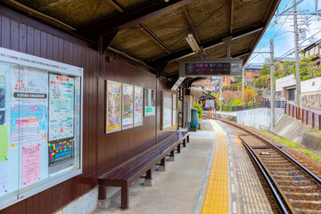 Kyoto, Japan - March 31 2023: Keifuku Tram is operated by Keifuku Electric Railroad. It consists of two tram lines and it's one of the best cherry blossom spots in the west of Kyoto city