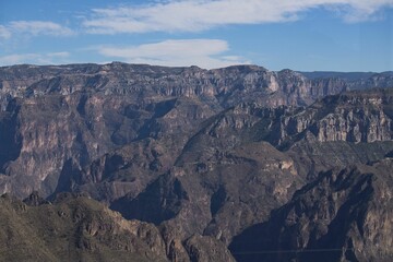 Fototapeta na wymiar Scenic view of the Copper Canyon in Mexico with rugged mountain range on a sunny day