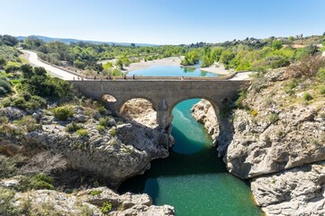 Aerial view of the Devil's Bridge over a narrow gorge of the Herault river in South France