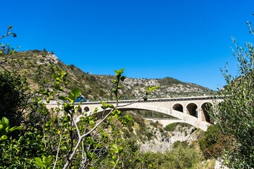 Fototapeta na wymiar Aerial view of the Devil's Bridge over a narrow gorge of the Herault river in South France