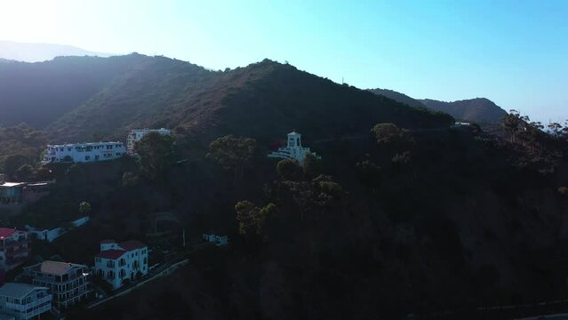Aerial of the Wrigley Memorial on the hill in Avalon, California on a sunny day