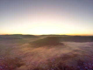 Aerial stunning view of a foggy sunset over Oberstenfeld, Germany