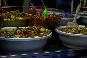 Market stall selling pickled olives preserved in olive oil, in Fes el Bali, in city of Fez, Morocco