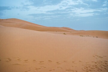 Sand dunes during sunset in Erg Chebbi desert, near Merzouga, Sahara Desert, in Morocco.