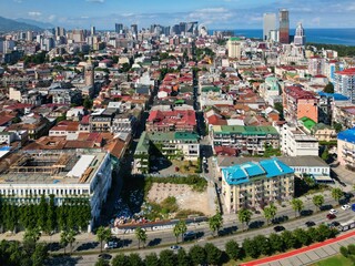 Aerial shot of a stunning beach in Batumi, Georgia with a backdrop of modern skyscrapers.