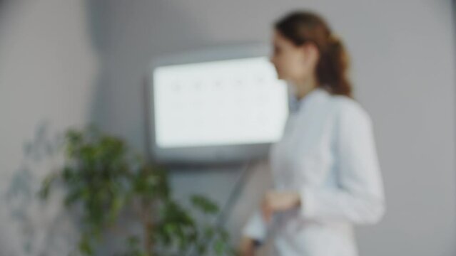 Blurred and after refocusing view of The ophthalmologist examines the patient's eye Doctor helping patient to select glasses