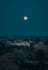 Vertical of the full moon seen from Ascot Hill Park near downtown Los Angeles