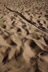 High angle shot of brown sand dune textures on a desert