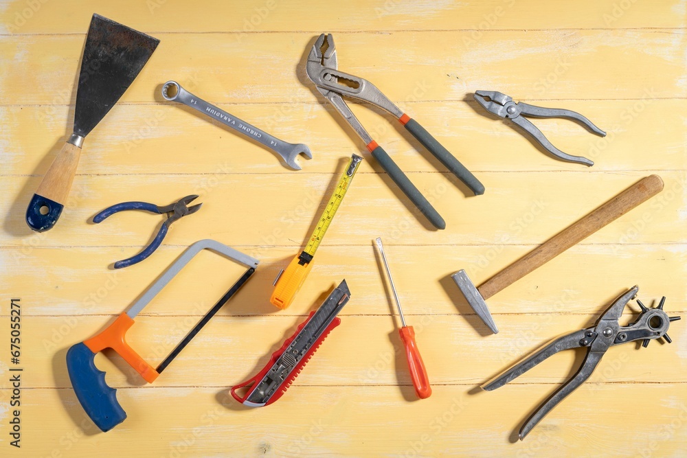 Wall mural top view of construction tools on a wooden table - industrial concept