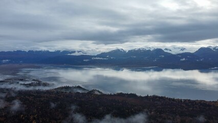Breathtaking view of the Kachemak Bay in Homer, Alaska shrouded in a mysterious fog